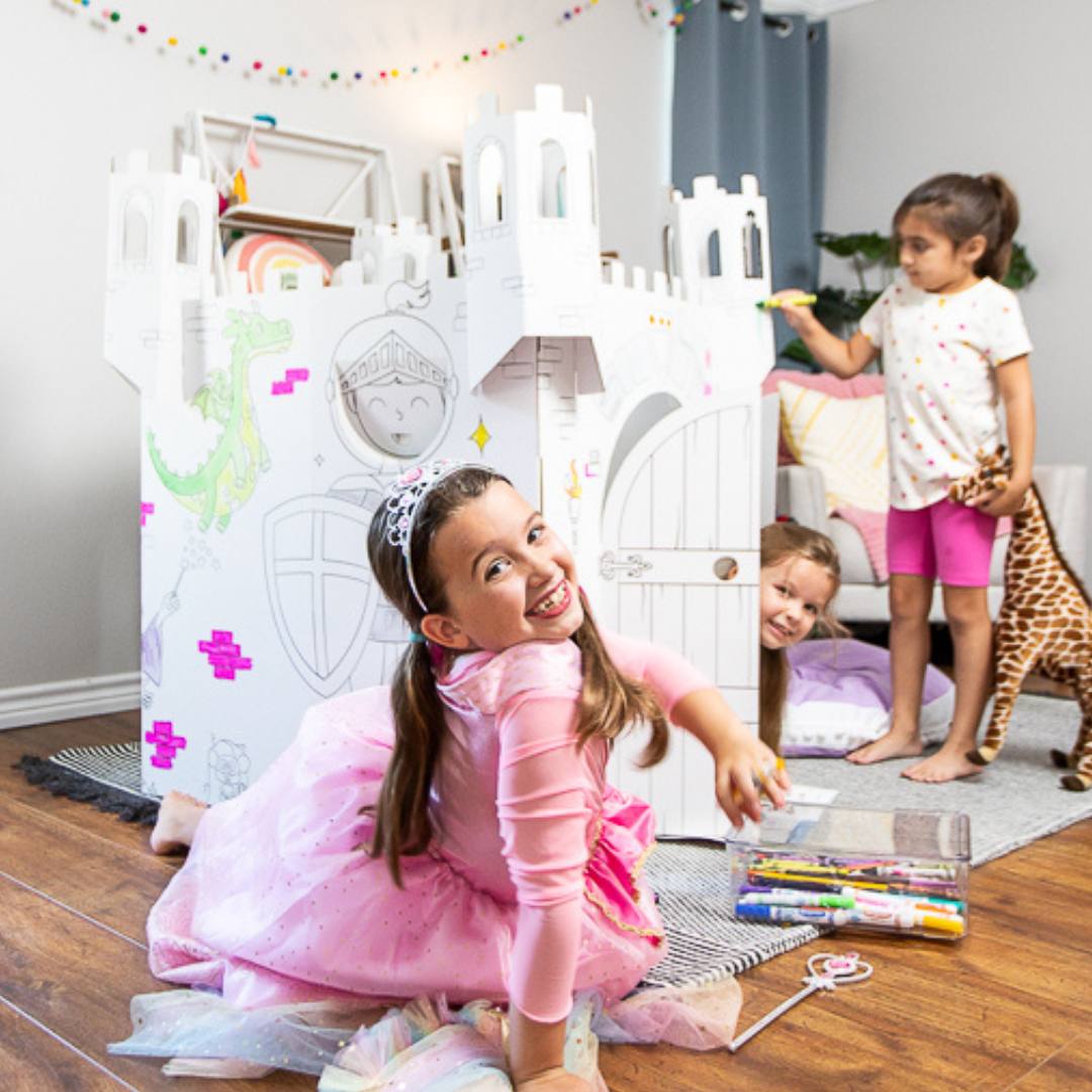 Playboxes fairy tale castle unicorn princess playhouse image showing three girls playing inside and outside of fairy tale castle unicorn princess playhouse and coloring the images printed on the box