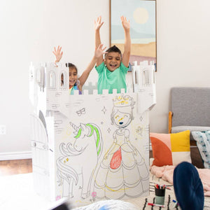 Playboxes fairy tale castle unicorn princess playhouse image showing boy and girl jumping up out of box with arms up inside of fairy tale castle unicorn princess playhouse