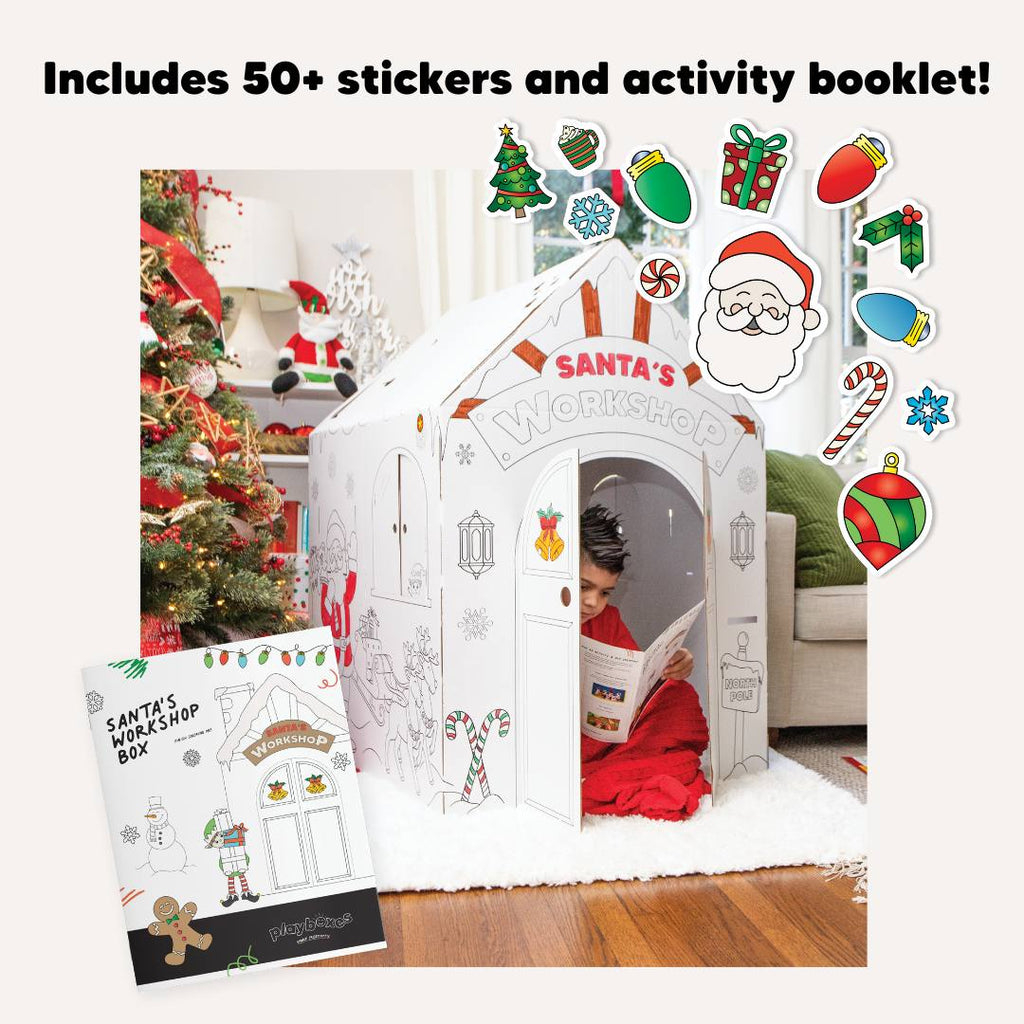 playboxes Santa's Workshop playhouse image showing boy reading activity booklet inside Santa's Workshop playhouse and shows the activity booklet and stickers that are included